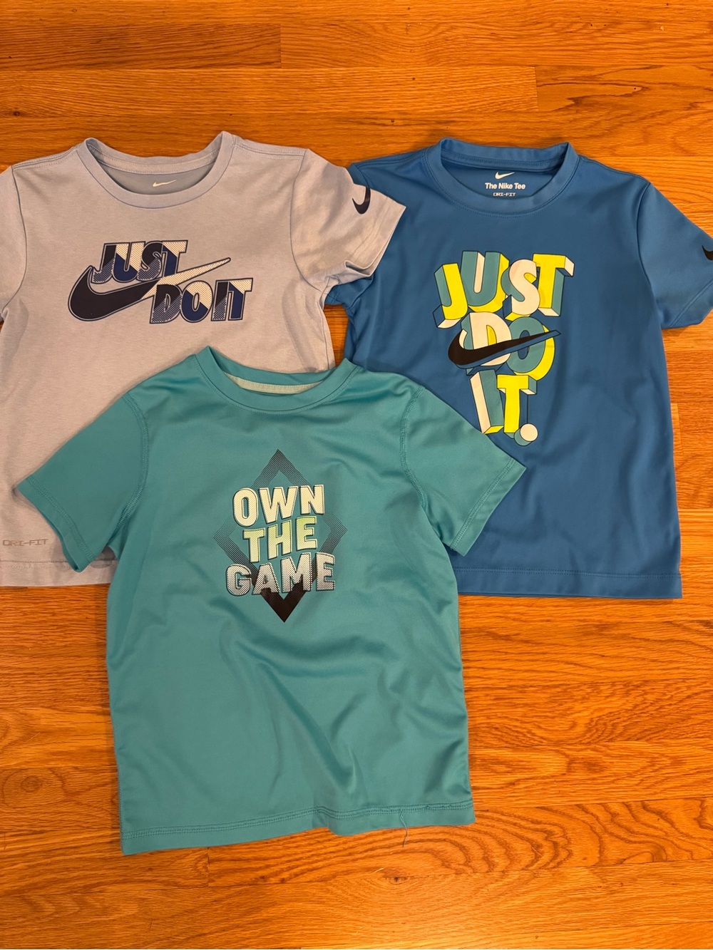 Nike Kids Short-Sleeve Tees in Light Gray, Teal, and Blue